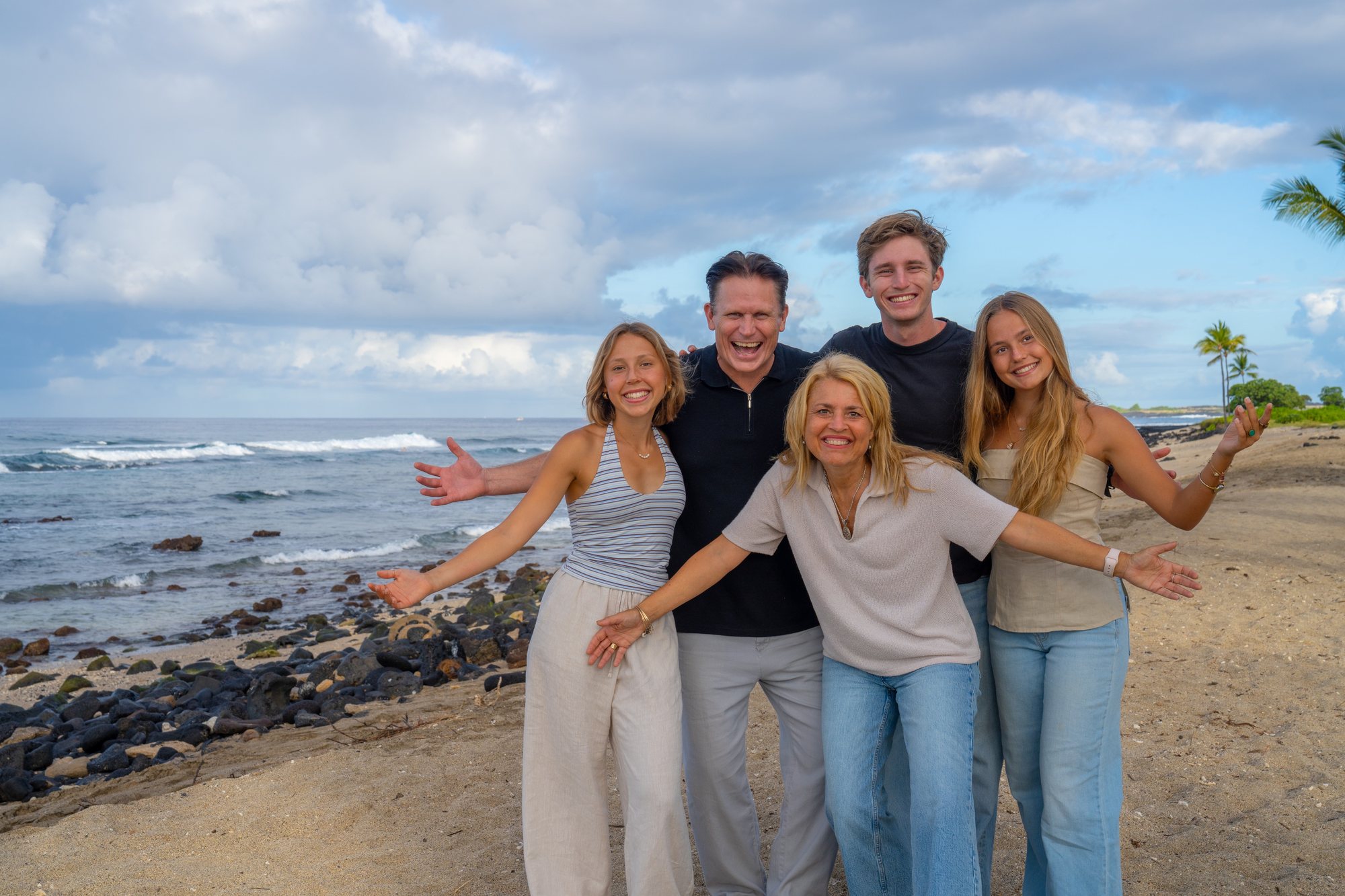 The Childers family on the Kona shore, arms open